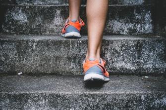 Woman walking up stairs